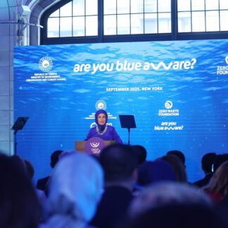 Audience listening to Emine Erdoğan, the First Lady of Turkey, through silent disco headphones for immersive translation at Drop by Drop – Zero Waste Blue
