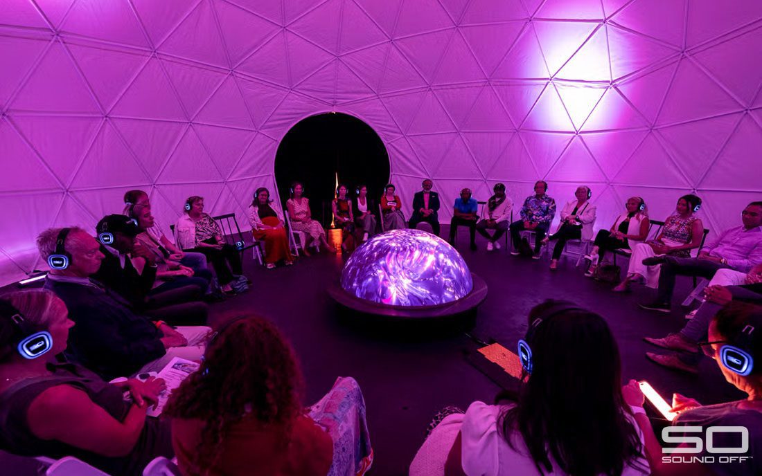 Participants experiencing the Lumisphere with Sound Off slient disco headphones