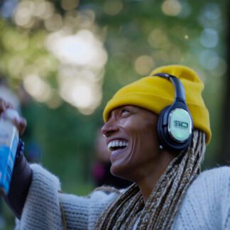 Guest wearing Sound Off headphones celebrating at a sober party