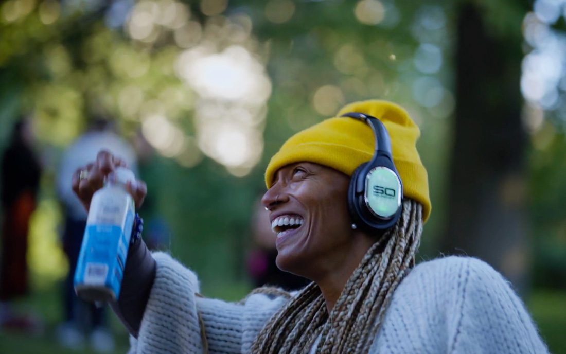 Guest wearing Sound Off headphones celebrating at a sober party